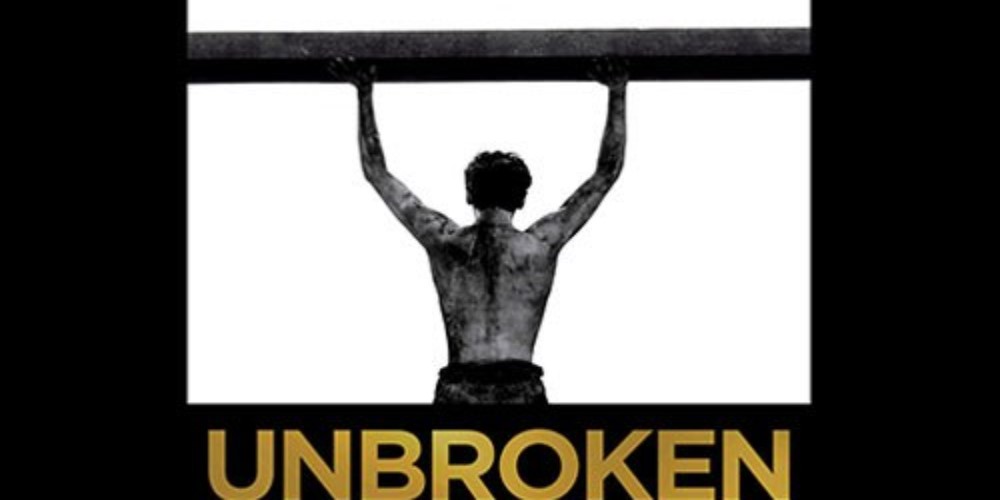 Person holding up beam with the words underneath saying unbroken