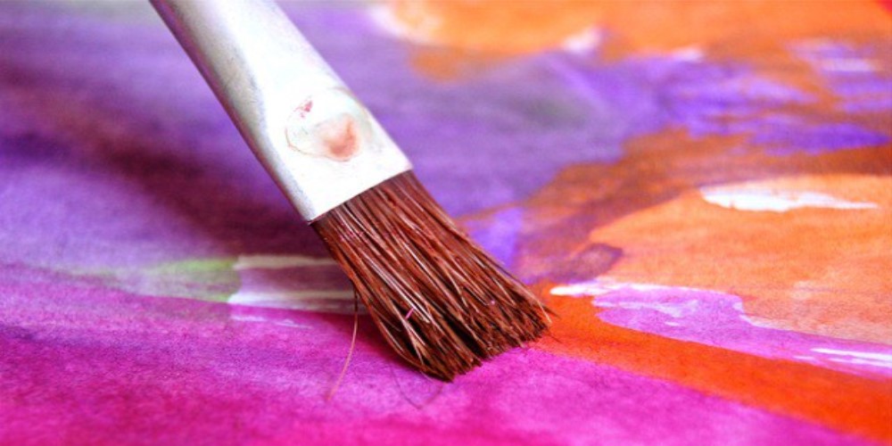 paint brush shown creating a colourful picture