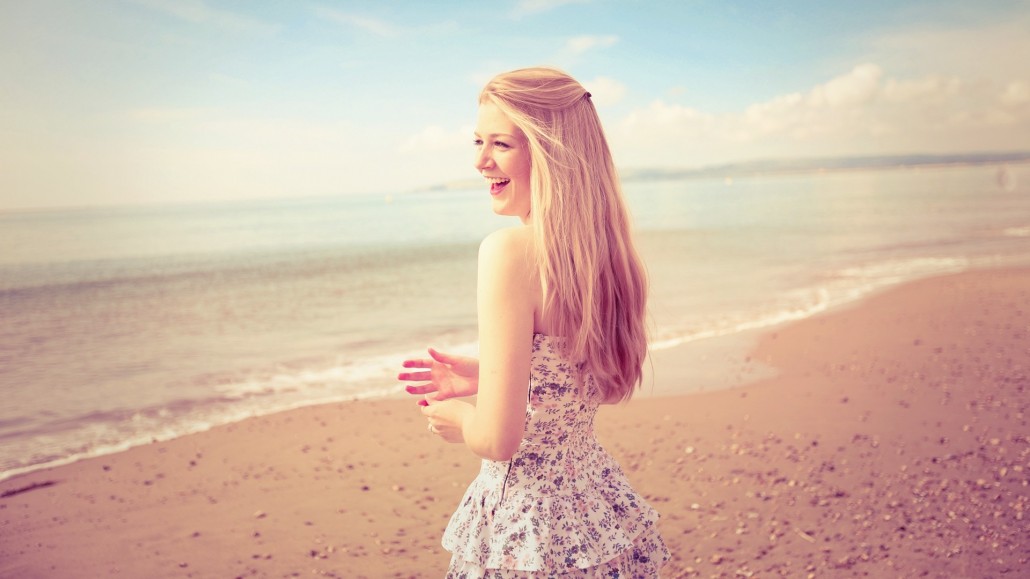 Woman on Beach in Morning, Smiling
