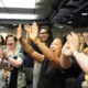 students with hands up at a life coaching event at the coaching institute