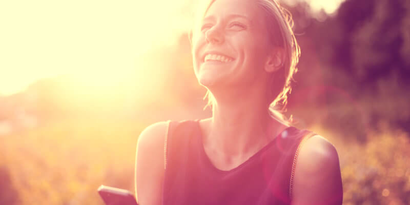 Girl smiling at sunset